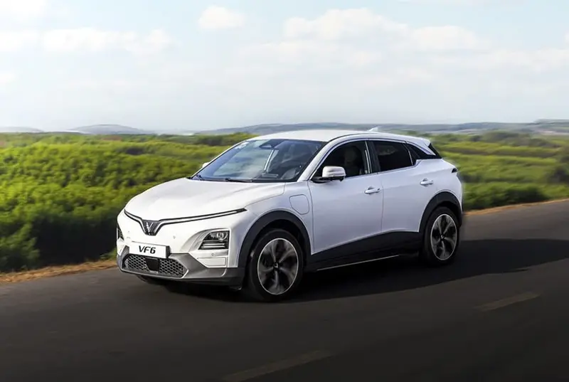 The VinFast VF 6 cruises the road with its modern design.