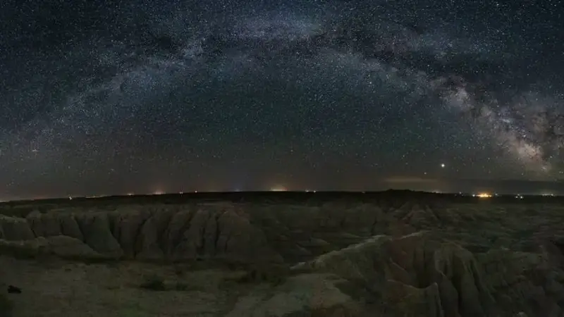The Milky Way glows over Badlands National Park, South Dakota.