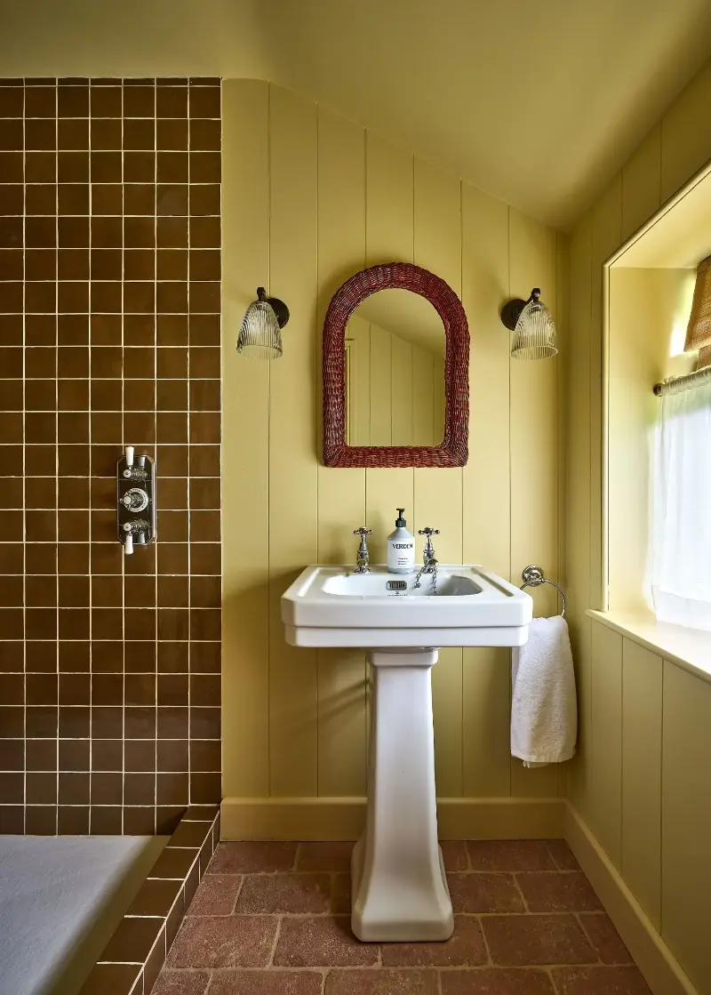 Yellow teamed with caramel is perfect for spaces where you want to embrace warmth while maintaining a fairly neutral, sophisticated feel. (Image credit: Ca' Pietra / @gem_boner of @restaries)