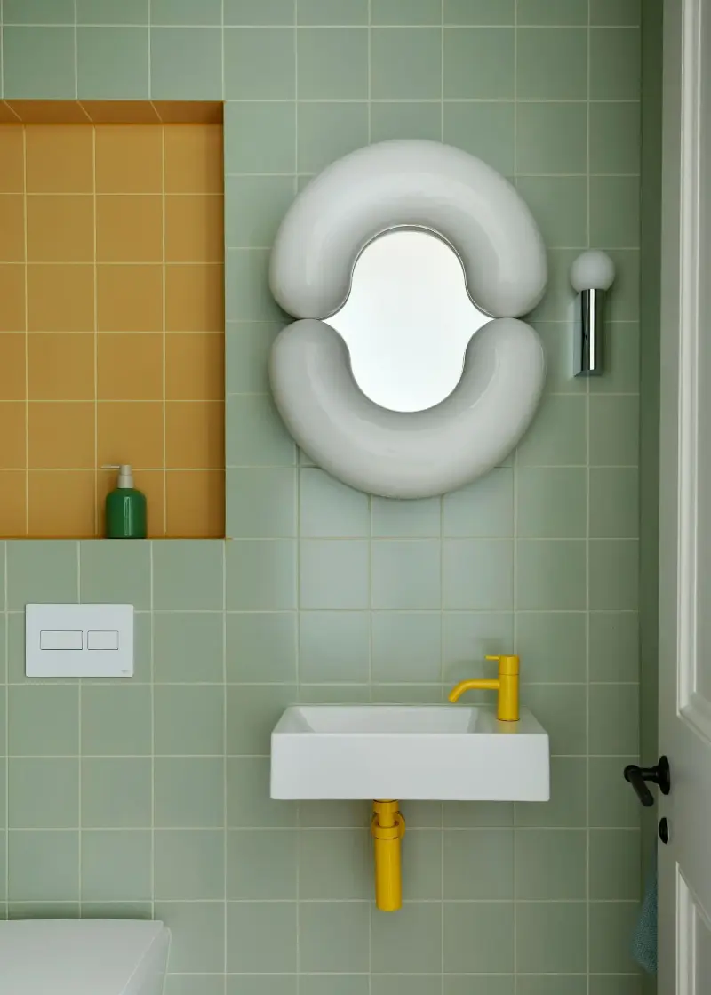 Mint green is elevated with pops of mustard yellow in this small bathroom —&nbsp;an unexpected pairing that feels fun and design-led. (Image credit: Rachael Smith. Design: Owl Design)