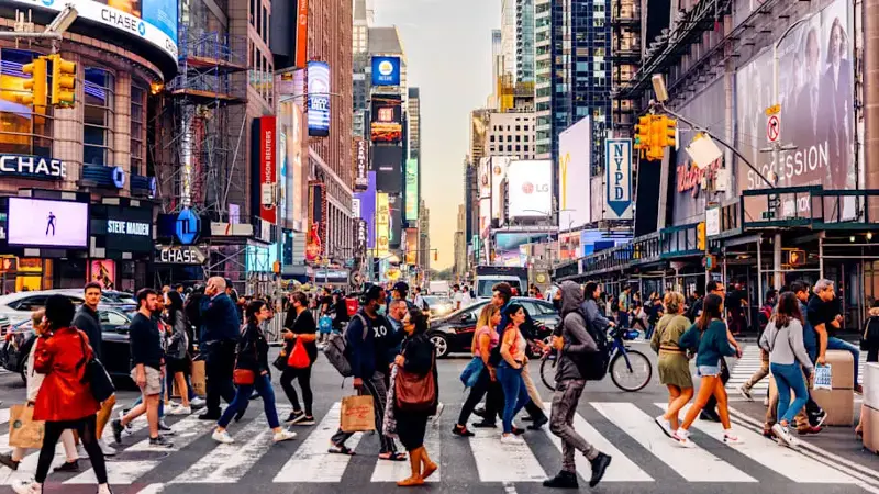 People crossing the street near Times Square, Manhattan, New York City, USA
