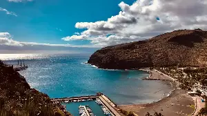 There is a language on a small Spanish island in the Canary archipelago that is made entirely of whistles, can carry a full sentence across six miles of mountain ravine, and is still taught to every child in school