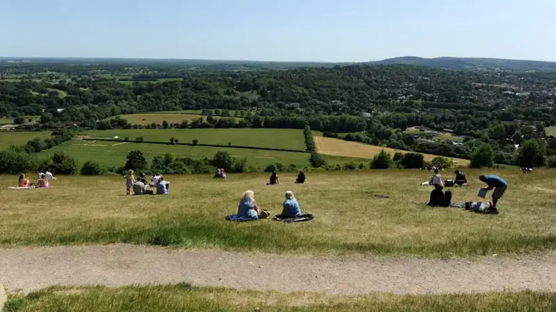 Picnickers enjoy Box Hill in Surrey.