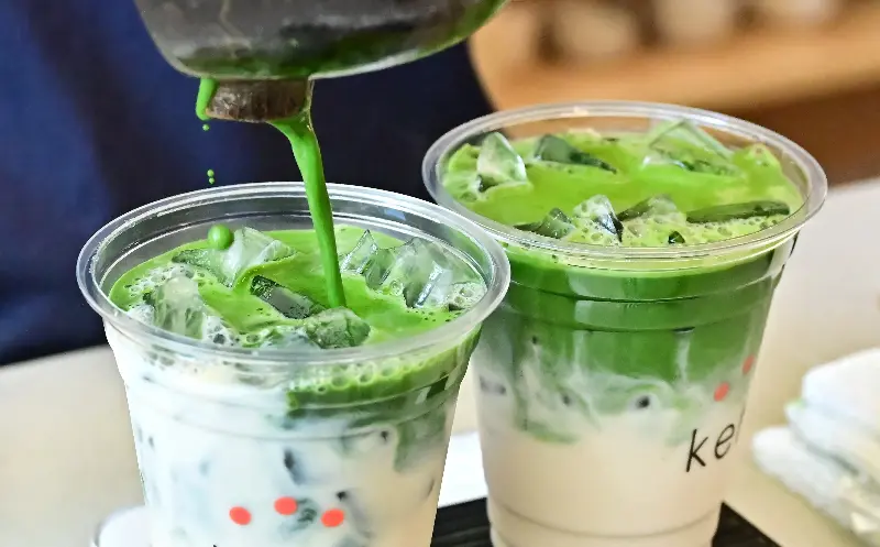 Green flag: would you slip into a big interview with a matcha latte? (AFP/Getty)
