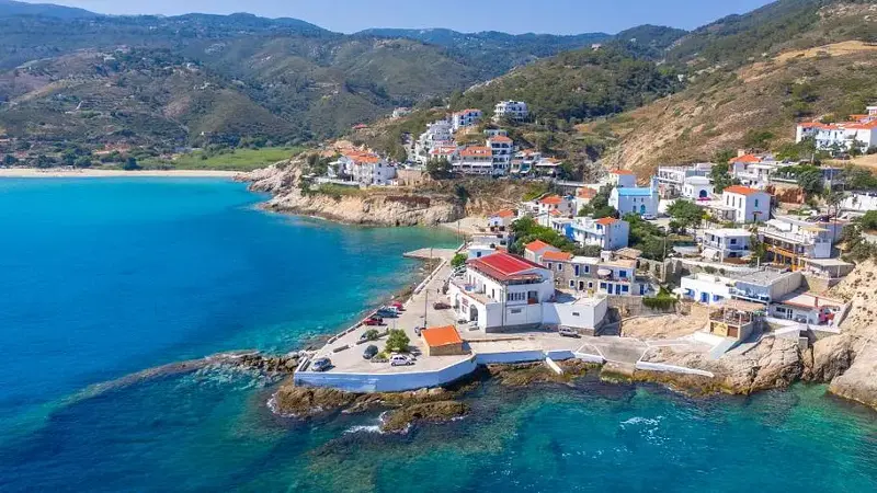 Picturesque small village of Armenistis with amazing sandy beach Mesakti in Ikaria island, Greece.