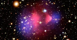 Astronomers found a third galaxy with almost no dark matter, and all three sit on the same straight line — pointing to a collision that tore ordinary matter loose