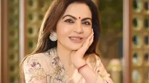 Nita Ambani’s giant diamond earrings are the ultimate showstopper in her elegant handwoven Banarasi saree look. See pics