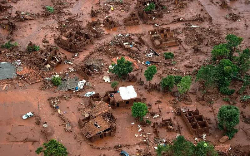 The village of Bento Rodrigues, in south-eastern Brazil, covered in mud after a dam burst in 2015 - Christophe Simon/AFP via Getty Images