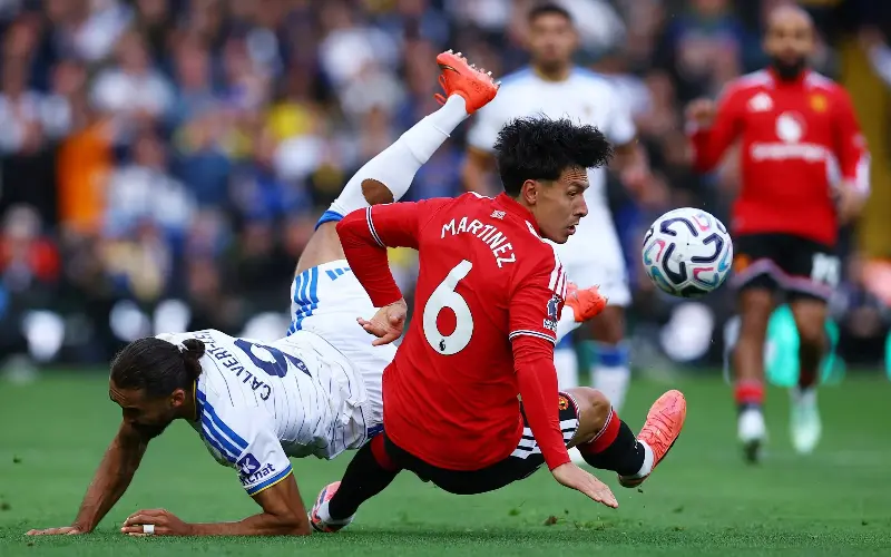 Lisandro Martinez and Dominic Calvert-Lewin tussle for possession - Reuters/Phil Noble