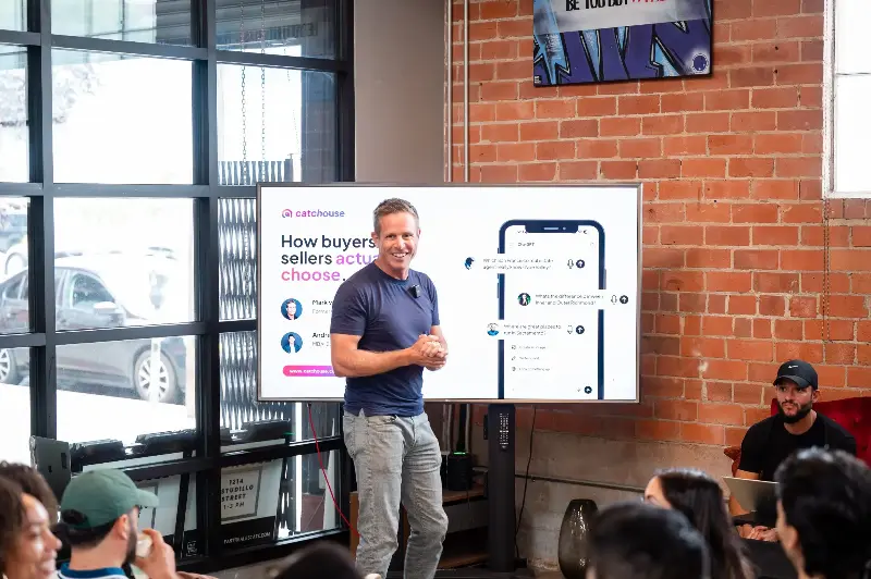 Mark van Ryzwzk, chief executive officer and founder of Catchouse, holds presentation on 'How to be discovered by AI' at the offices of FAST Real Estate in Oakland, California on September 26.