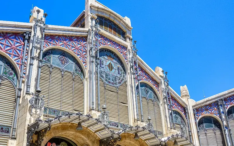 Valencia, Spain-September 20, 2022: The upper part of the facade of an old building with geometric patterns and designs. No people are on the scene.