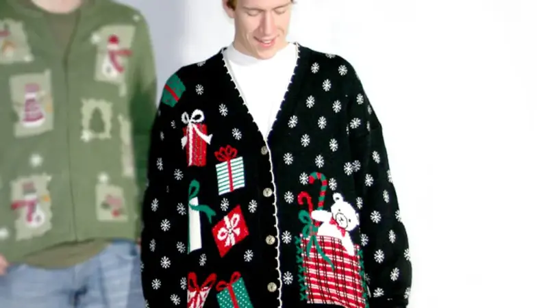 man wears vintage 80s ugly christmas sweater