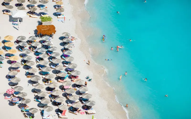 Albania’s beaches, such as Himare, offer row upon row of umbrellas and beach clubs - Amazing Aerial/Alamy Stock Photo