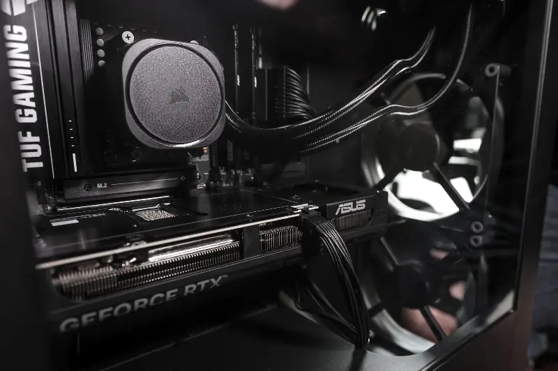 Interior of a gaming PC with liquid cooling system and ASUS components