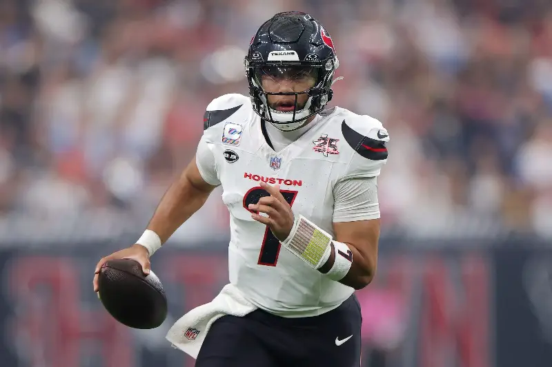 HOUSTON, TEXAS - OCTOBER 04: C.J. Stroud #7 of the Houston Texans scrambles with the ball against the Dallas Cowboys during the first quarter at NRG Stadium on October 04, 2026 in Houston, Texas. (Photo by Alex Slitz/Getty Images)