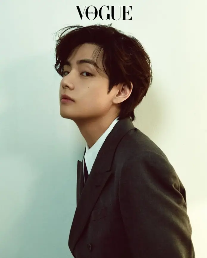 V in a suit, with tousled hair, against a light background. The text 'VOGUE KOREA' is displayed at the top.
