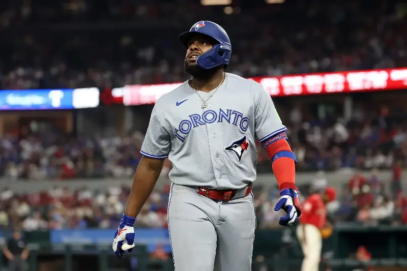 ARLINGTON, TEXAS - SEPTEMBER 18: Vladimir Guerrero Jr. #27 of the Toronto Blue Jays walks to the dugout during the fourth inning against the Texas Rangers at Globe Life Field on September 18, 2026 in Arlington, Texas. (Photo by Stacy Revere/Getty Images)