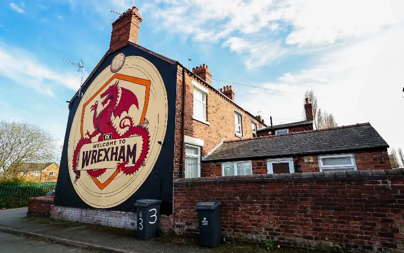 Wrexham gained prominence after Ryan Reynolds and Rob McElhenney took over Wrexham AFC in 2020 - Robbie Jay Barratt - AMA