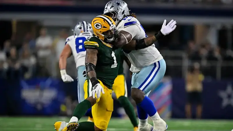 Tyler Guyton blocks defensive end Micah Parsons during the game between the Dallas Cowboys and the Green Bay Packers.