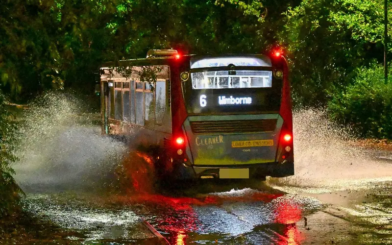 A bus drives through flooding in Bournemouth at Storm Austen arrives - Graham Hunt / Alamy Live News
