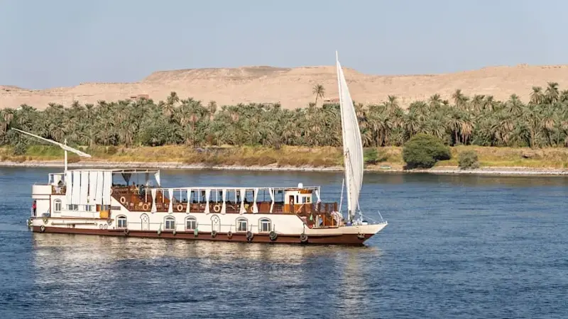 Dahabiya sailing Nile cruise boat traditionally engine-less and towed by tug