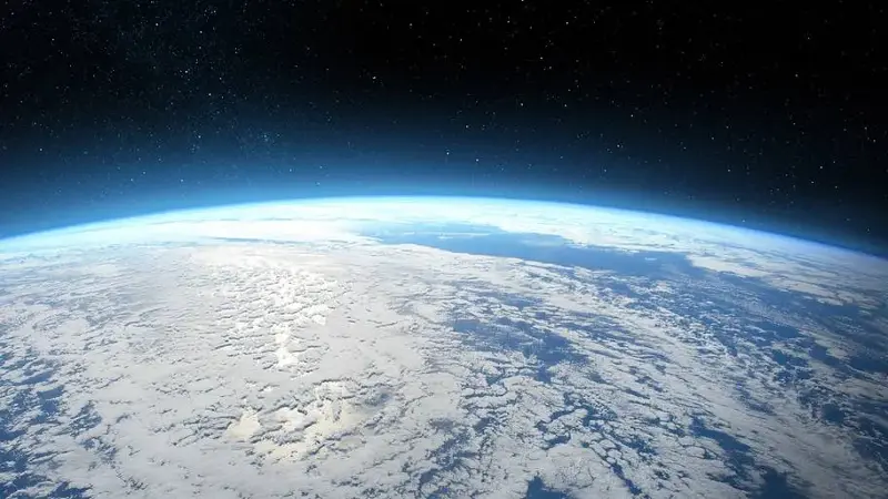 Earth viewed from space with stars in the distance