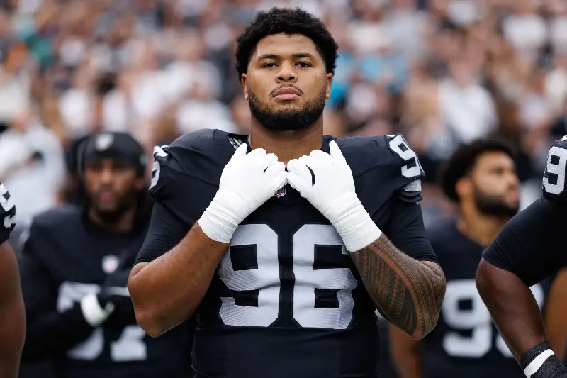 LAS VEGAS, NEVADA - SEPTEMBER 13: Jonah Laulu #96 of the Las Vegas Raiders stands on the sidelines during the national anthem prior to an NFL football game against the Miami Dolphins at Allegiant Stadium on September 13, 2026 in Las Vegas, Nevada. (Photo by Brooke Sutton/Getty Images)