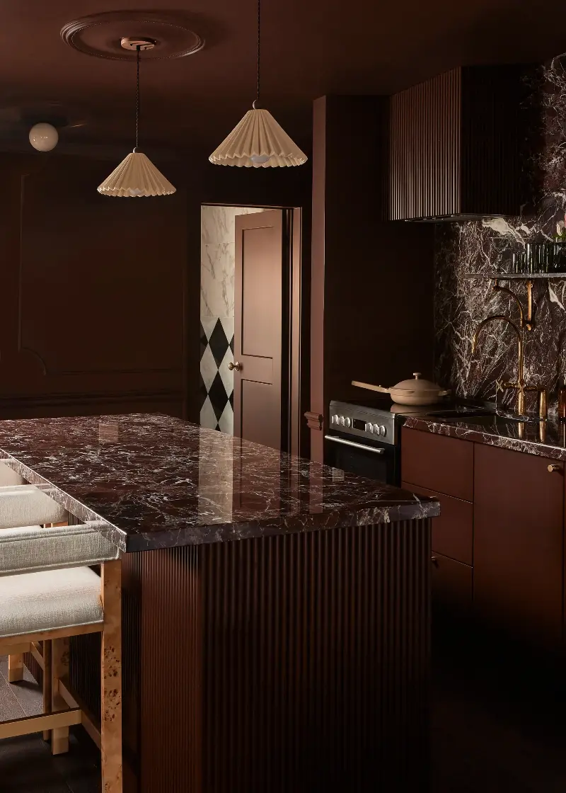 This dark red kitchen goes all in on this dramatic, atmospheric palette.  (Image credit: &nbsp;Lauren Miller. Design: Hotel Julie, Ontario, Canada. Design by: Twenty-Two Twelve & You Should Stay Here)