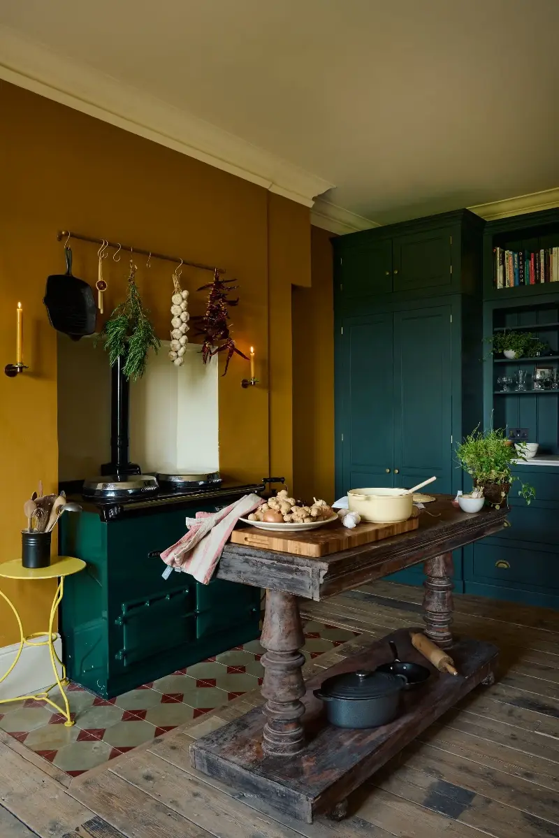 Tie in natural materials like dark wood, traditional tiles, and brass for a warming mood (Image credit: deVOL)