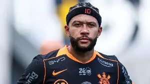 Memphis Depay explains why he was using his PHONE while sat on Corinthians bench as video shows staff appearing to scold Netherlands star