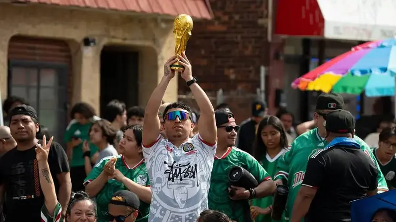 Fans watch as Mexico plays South Africa