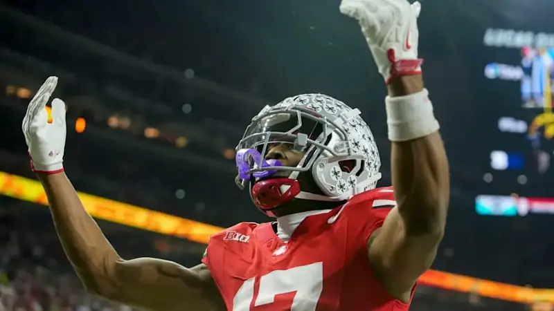 Carnell Tate celebrates a touchdown during the Big Ten Championship Game against the Indiana Hoosiers.