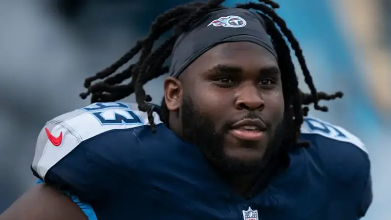 T'Vondre Sweat takes the field before their game against the New England Patriots at Nissan Stadium.