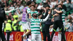 HUGE drama as Celtic beat Hearts to win Scottish Premiership title on final day as jubilant fans invade pitch after Callum Osmand runs pitch to score in empty net