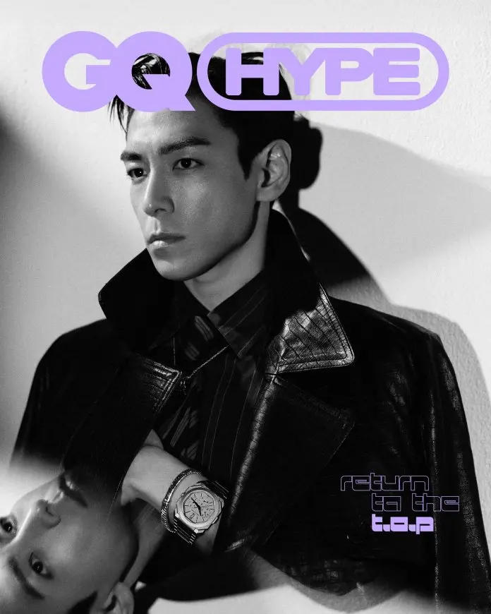 T.O.P wearing a leather jacket, gazing thoughtfully to the side. The image features bold purple text overlay that reads 'GQ HYPE' and 'return to the t.o.p'.