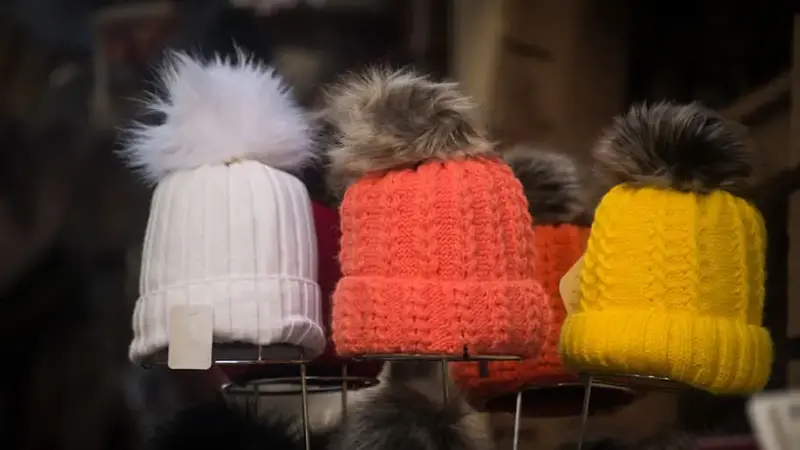 colorful woolen hats at the market in the street
