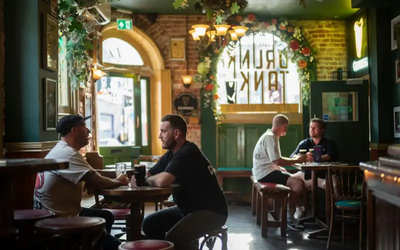 Customers enjoy a pint a Pogue Mahon’s in Norwich, which hosts live music every night of the week - David Rose