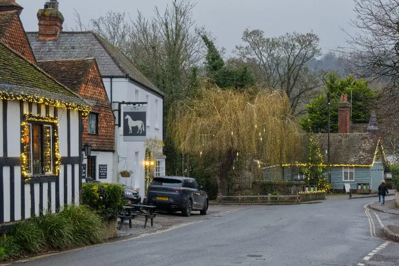 Shere pub, the 15th-century White Horse, is a local institution - Alamy