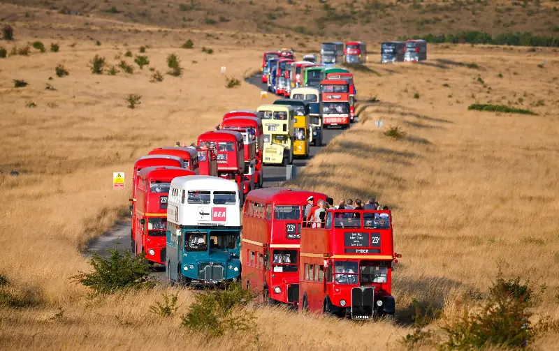 A parade of vintage buses ferrying passengers from the abandoned village of Imber - Getty Images/Finnbarr Webster