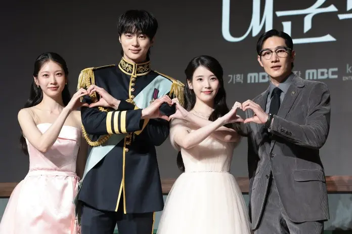 Perfect Crown cast posing together, making heart shapes with their hands. 