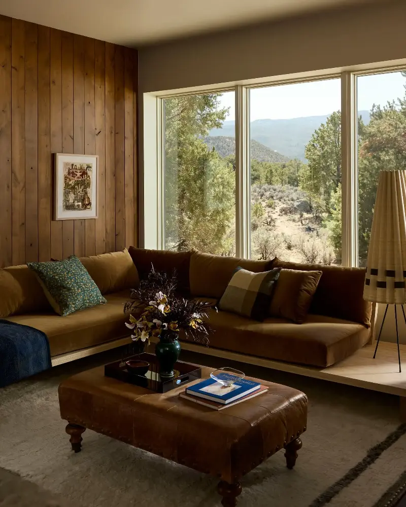 The landscape views become art in their own right, and the warm interiors tone naturally with the surroundings. (Image credit: Malissa Mabey. Design: Susannah Holmberg Studios. Styling: Jen Paul)