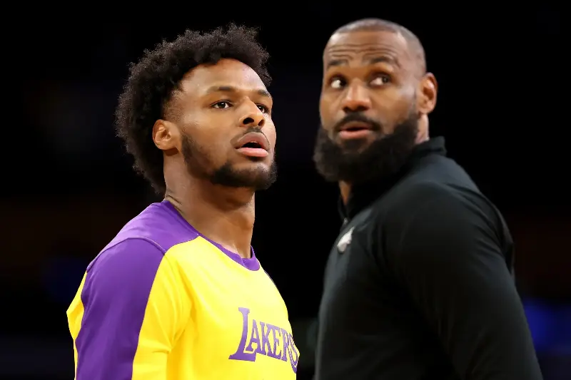 Bronny James #9 and LeBron James #23 of the Los Angeles Lakers look on before the game against the LA Clippers at Crypto.com Arena on March 02, 2025, in Los Angeles, California. (Photo by Luke Hales/Getty Images)
