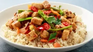 Quick Tofu Vegetable Stir Fry For A Nutritious Plant-Based Meal With Peanut Sauce And Fresh Produce