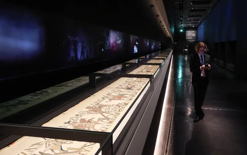 The 230ft embroidery has been laid flat for exhibition on its return to Britain - AFP via Getty Images/Ludovic Marin