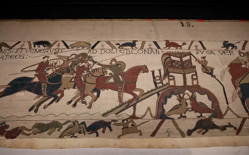 The tapestry, depicting the Norman conquest of England, is on loan from France - AFP via Getty Images/Ludovic Marin