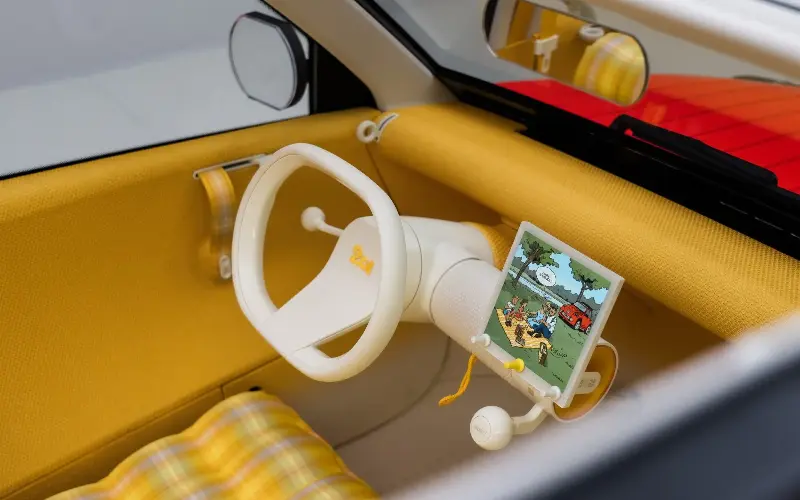 The new 2CV concept features a Bakelite-style cream single-spoke steering wheel - Simon Thompson