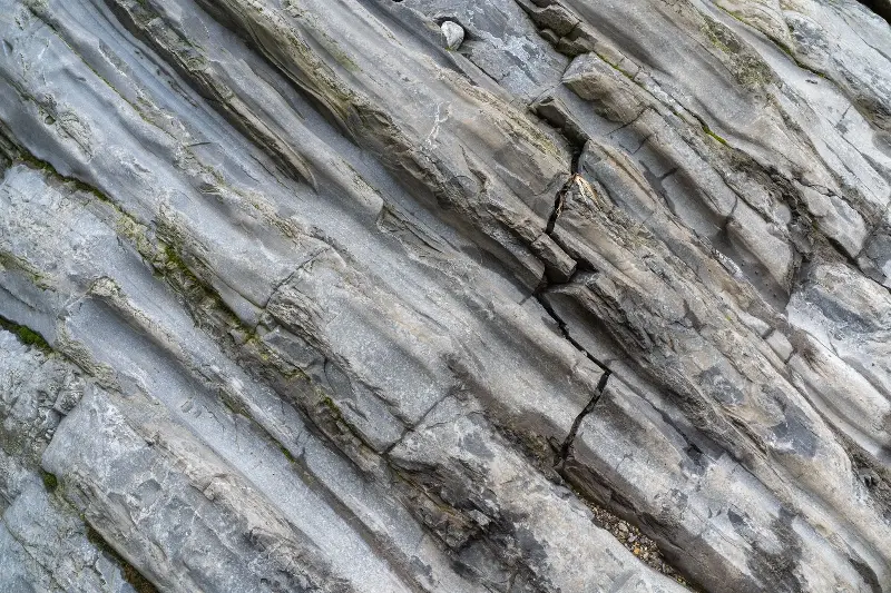 Close-up of a unique striated rock texture revealing natural geological formations.