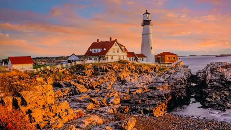 On the rocky coastline with Portland Head Light, Maine