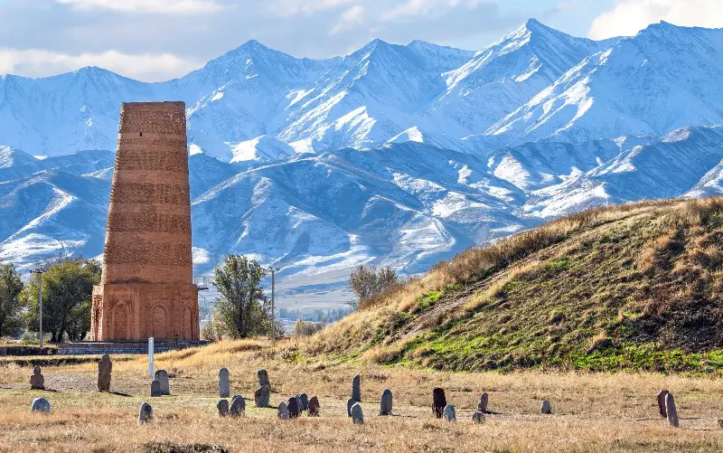 The ancient site of Burana with its minaret and gravestones - Ozbalci/iStockphoto
