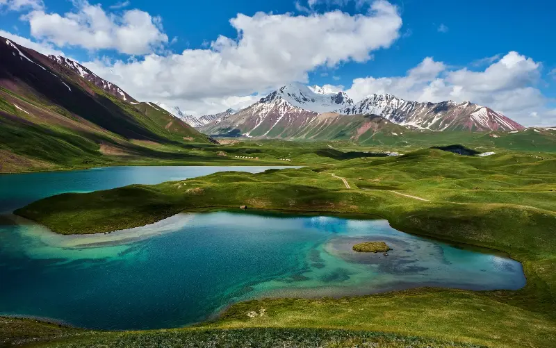 One of the ‘extraordinary turquoise lakes’ that can be found at altitude, fed by the ice - Tuul and Bruno Morandi